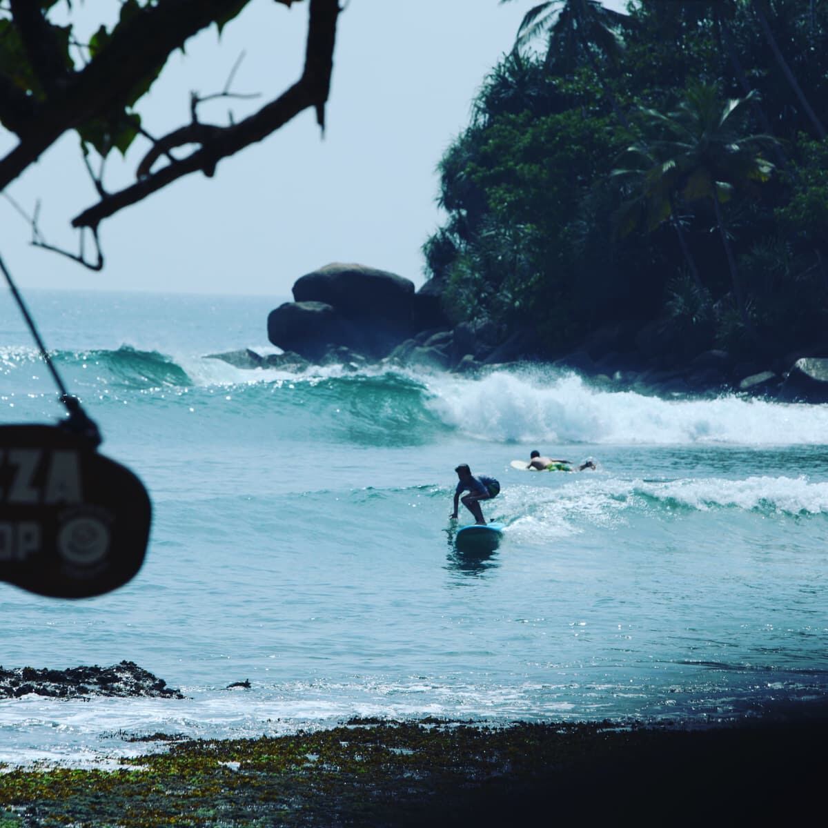 Ahangama pointbreak seen through a beach shack
